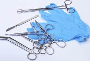 A set of surgical tools on a white background.